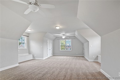 Nestled in a peaceful setting in Gates Four, this beautiful home on Gates Four Golf and Country Club in North Carolina - for sale on GolfHomes.com, golf home, golf lot