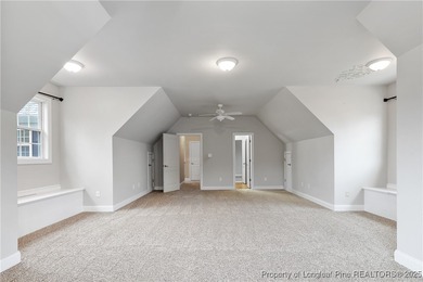 Nestled in a peaceful setting in Gates Four, this beautiful home on Gates Four Golf and Country Club in North Carolina - for sale on GolfHomes.com, golf home, golf lot