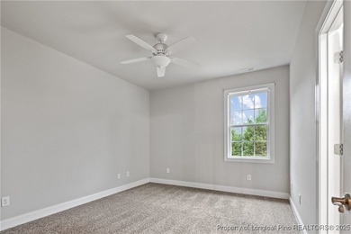 Nestled in a peaceful setting in Gates Four, this beautiful home on Gates Four Golf and Country Club in North Carolina - for sale on GolfHomes.com, golf home, golf lot