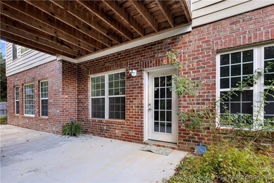 Nestled in a peaceful setting in Gates Four, this beautiful home on Gates Four Golf and Country Club in North Carolina - for sale on GolfHomes.com, golf home, golf lot