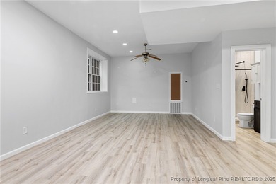 Nestled in a peaceful setting in Gates Four, this beautiful home on Gates Four Golf and Country Club in North Carolina - for sale on GolfHomes.com, golf home, golf lot