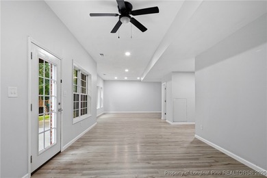 Nestled in a peaceful setting in Gates Four, this beautiful home on Gates Four Golf and Country Club in North Carolina - for sale on GolfHomes.com, golf home, golf lot