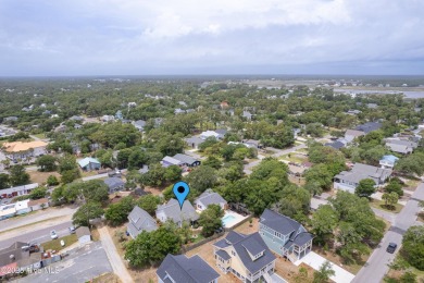 Cottage Cute, this Oak Island 3 bedroom 2 bath home is where on Founders Club At St. James Plantation in North Carolina - for sale on GolfHomes.com, golf home, golf lot
