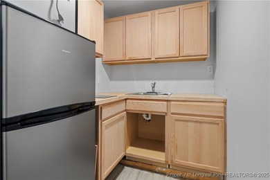 Nestled in a peaceful setting in Gates Four, this beautiful home on Gates Four Golf and Country Club in North Carolina - for sale on GolfHomes.com, golf home, golf lot