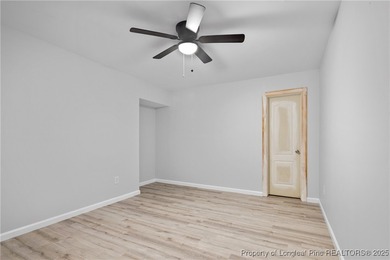 Nestled in a peaceful setting in Gates Four, this beautiful home on Gates Four Golf and Country Club in North Carolina - for sale on GolfHomes.com, golf home, golf lot