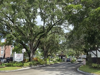 Nestled in a highly desirable International Village community on Inverrary Country Club in Florida - for sale on GolfHomes.com, golf home, golf lot