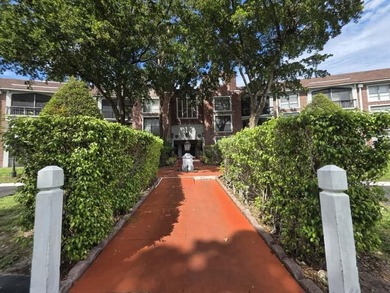 Nestled in a highly desirable International Village community on Inverrary Country Club in Florida - for sale on GolfHomes.com, golf home, golf lot