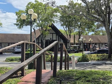 Nestled in a highly desirable International Village community on Inverrary Country Club in Florida - for sale on GolfHomes.com, golf home, golf lot