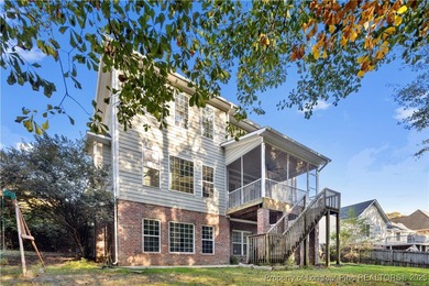 Nestled in a peaceful setting in Gates Four, this beautiful home on Gates Four Golf and Country Club in North Carolina - for sale on GolfHomes.com, golf home, golf lot