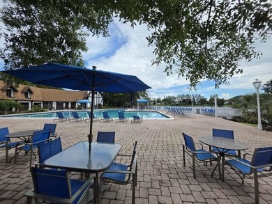 Nestled in a highly desirable International Village community on Inverrary Country Club in Florida - for sale on GolfHomes.com, golf home, golf lot