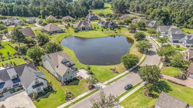 Stunning and beautifully appointed, this 3,431 heated square on Wild Wing Plantation in South Carolina - for sale on GolfHomes.com, golf home, golf lot