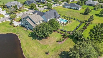 Stunning and beautifully appointed, this 3,431 heated square on Wild Wing Plantation in South Carolina - for sale on GolfHomes.com, golf home, golf lot
