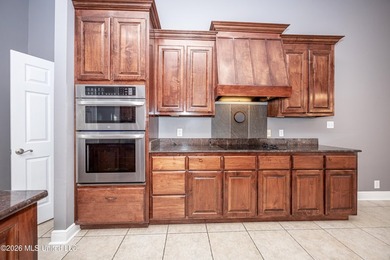 Located in a prestigious gated golf course community, this on Shell Landing Golf Club in Mississippi - for sale on GolfHomes.com, golf home, golf lot