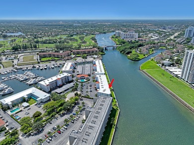 Enjoy waterfront living with wide water views from this freshly on North Palm Beach Country Club in Florida - for sale on GolfHomes.com, golf home, golf lot