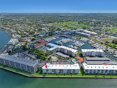 Enjoy waterfront living with wide water views from this freshly on North Palm Beach Country Club in Florida - for sale on GolfHomes.com, golf home, golf lot