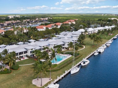 Experience waterfront living at its finest in this ground-floor on Card Sound Golf Club in Florida - for sale on GolfHomes.com, golf home, golf lot