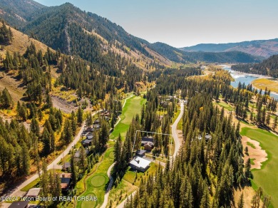 Welcome to a stunning residence nestled within the prestigious on Snake River Sporting Club in Wyoming - for sale on GolfHomes.com, golf home, golf lot