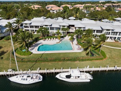 Experience waterfront living at its finest in this ground-floor on Card Sound Golf Club in Florida - for sale on GolfHomes.com, golf home, golf lot