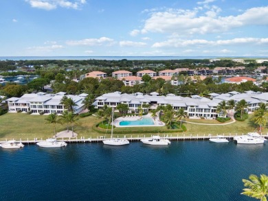 Experience waterfront living at its finest in this ground-floor on Card Sound Golf Club in Florida - for sale on GolfHomes.com, golf home, golf lot