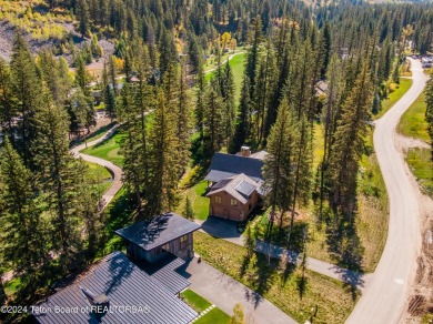 Welcome to a stunning residence nestled within the prestigious on Snake River Sporting Club in Wyoming - for sale on GolfHomes.com, golf home, golf lot