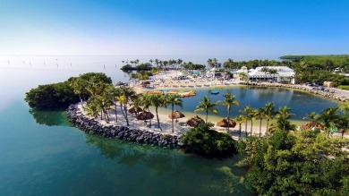 Experience waterfront living at its finest in this ground-floor on Card Sound Golf Club in Florida - for sale on GolfHomes.com, golf home, golf lot