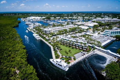 Experience waterfront living at its finest in this ground-floor on Card Sound Golf Club in Florida - for sale on GolfHomes.com, golf home, golf lot