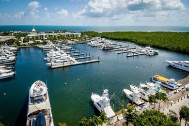 Experience waterfront living at its finest in this ground-floor on Card Sound Golf Club in Florida - for sale on GolfHomes.com, golf home, golf lot