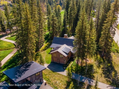 Welcome to a stunning residence nestled within the prestigious on Snake River Sporting Club in Wyoming - for sale on GolfHomes.com, golf home, golf lot