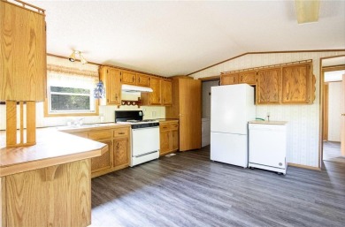 Well-kept and updated 3 bed/2 bath manufactured home on nearly on Moose Lake Golf Club in Minnesota - for sale on GolfHomes.com, golf home, golf lot