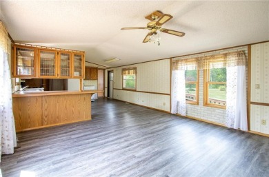 Well-kept and updated 3 bed/2 bath manufactured home on nearly on Moose Lake Golf Club in Minnesota - for sale on GolfHomes.com, golf home, golf lot