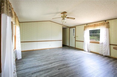 Well-kept and updated 3 bed/2 bath manufactured home on nearly on Moose Lake Golf Club in Minnesota - for sale on GolfHomes.com, golf home, golf lot