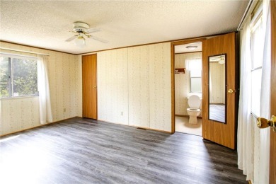 Well-kept and updated 3 bed/2 bath manufactured home on nearly on Moose Lake Golf Club in Minnesota - for sale on GolfHomes.com, golf home, golf lot