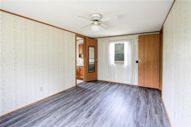 Well-kept and updated 3 bed/2 bath manufactured home on nearly on Moose Lake Golf Club in Minnesota - for sale on GolfHomes.com, golf home, golf lot