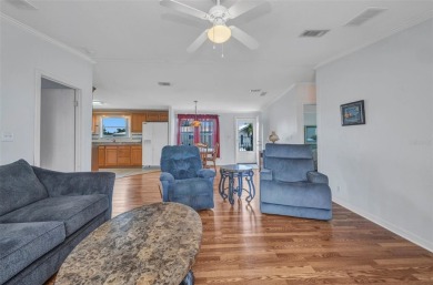 Welcome to 5748 Holiday Park Blvd.  This home is located in the on Sabal Trace Golf and Country Club in Florida - for sale on GolfHomes.com, golf home, golf lot