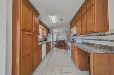 Welcome to 5748 Holiday Park Blvd.  This home is located in the on Sabal Trace Golf and Country Club in Florida - for sale on GolfHomes.com, golf home, golf lot