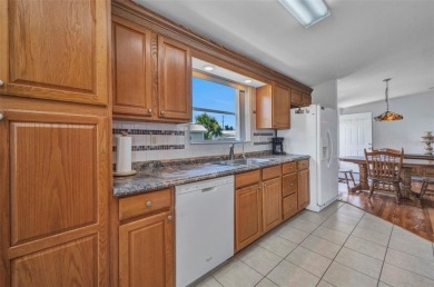 Welcome to 5748 Holiday Park Blvd.  This home is located in the on Sabal Trace Golf and Country Club in Florida - for sale on GolfHomes.com, golf home, golf lot
