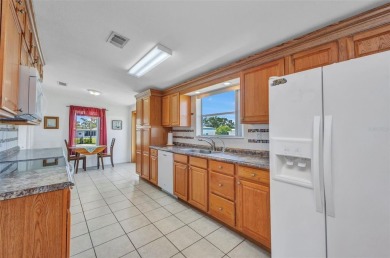 Welcome to 5748 Holiday Park Blvd.  This home is located in the on Sabal Trace Golf and Country Club in Florida - for sale on GolfHomes.com, golf home, golf lot
