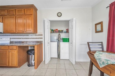 Welcome to 5748 Holiday Park Blvd.  This home is located in the on Sabal Trace Golf and Country Club in Florida - for sale on GolfHomes.com, golf home, golf lot