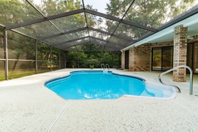 This remarkable, all brick home on 0.55 Acre with a screened on The Club At Hidden Creek in Florida - for sale on GolfHomes.com, golf home, golf lot