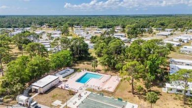 Welcome to 5748 Holiday Park Blvd.  This home is located in the on Sabal Trace Golf and Country Club in Florida - for sale on GolfHomes.com, golf home, golf lot