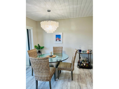 Welcome to Maintenance-Free, Resort-Style Living -- Relax & on Isla Del Sol Yacht and Country Club in Florida - for sale on GolfHomes.com, golf home, golf lot