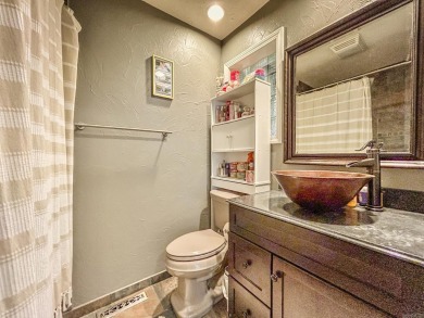 Beautifully updated 4 bedroom, 2 bathroom home in Village Green on Twin Lakes Golf Club in Arkansas - for sale on GolfHomes.com, golf home, golf lot