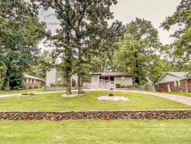 Beautifully updated 4 bedroom, 2 bathroom home in Village Green on Twin Lakes Golf Club in Arkansas - for sale on GolfHomes.com, golf home, golf lot