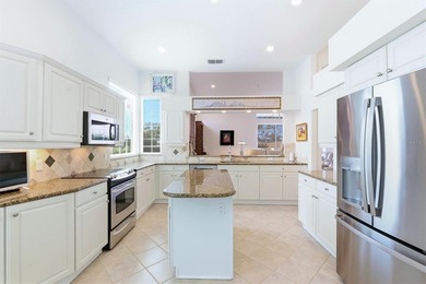 Impeccably appointed pool home on the Bobcat Course, hole #2, in on Plantation Golf and Country Club in Florida - for sale on GolfHomes.com, golf home, golf lot