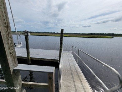 Uncommon riverfront home site in the popular and amenity-rich on Carolina National Golf Club in North Carolina - for sale on GolfHomes.com, golf home, golf lot