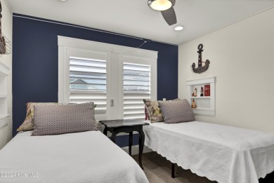 Welcome to 25 Newport Street, a breathtaking coastal retreat on Sea Trail Golf Resort in North Carolina - for sale on GolfHomes.com, golf home, golf lot