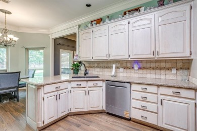 Welcome to this elegant 3-bedroom, 2.5-bath home located in the on Pecan Plantation Country Club in Texas - for sale on GolfHomes.com, golf home, golf lot