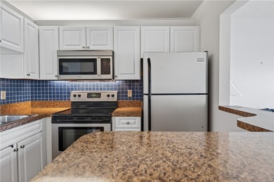 Enjoy carefree Florida living in this clean 1BR/1BA 2nd-floor on The American Golf Club in Florida - for sale on GolfHomes.com, golf home, golf lot