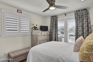 Welcome to 25 Newport Street, a breathtaking coastal retreat on Sea Trail Golf Resort in North Carolina - for sale on GolfHomes.com, golf home, golf lot