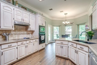 Welcome to this elegant 3-bedroom, 2.5-bath home located in the on Pecan Plantation Country Club in Texas - for sale on GolfHomes.com, golf home, golf lot